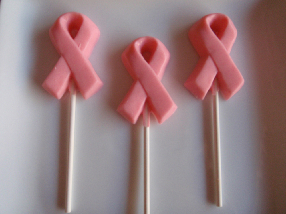 Pink ribbon lollipops are shown here.