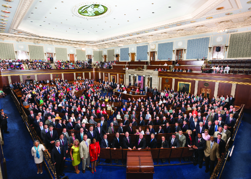 An aerial image of a large group of people standing in a room.