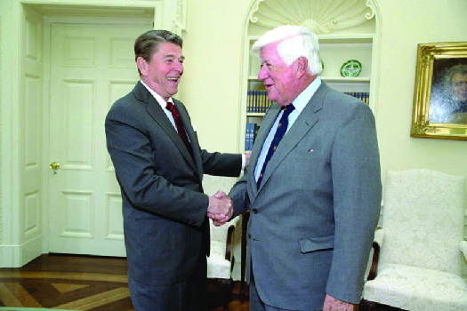 An image of Ronald Reagan shaking hands with Tip O’Neil.